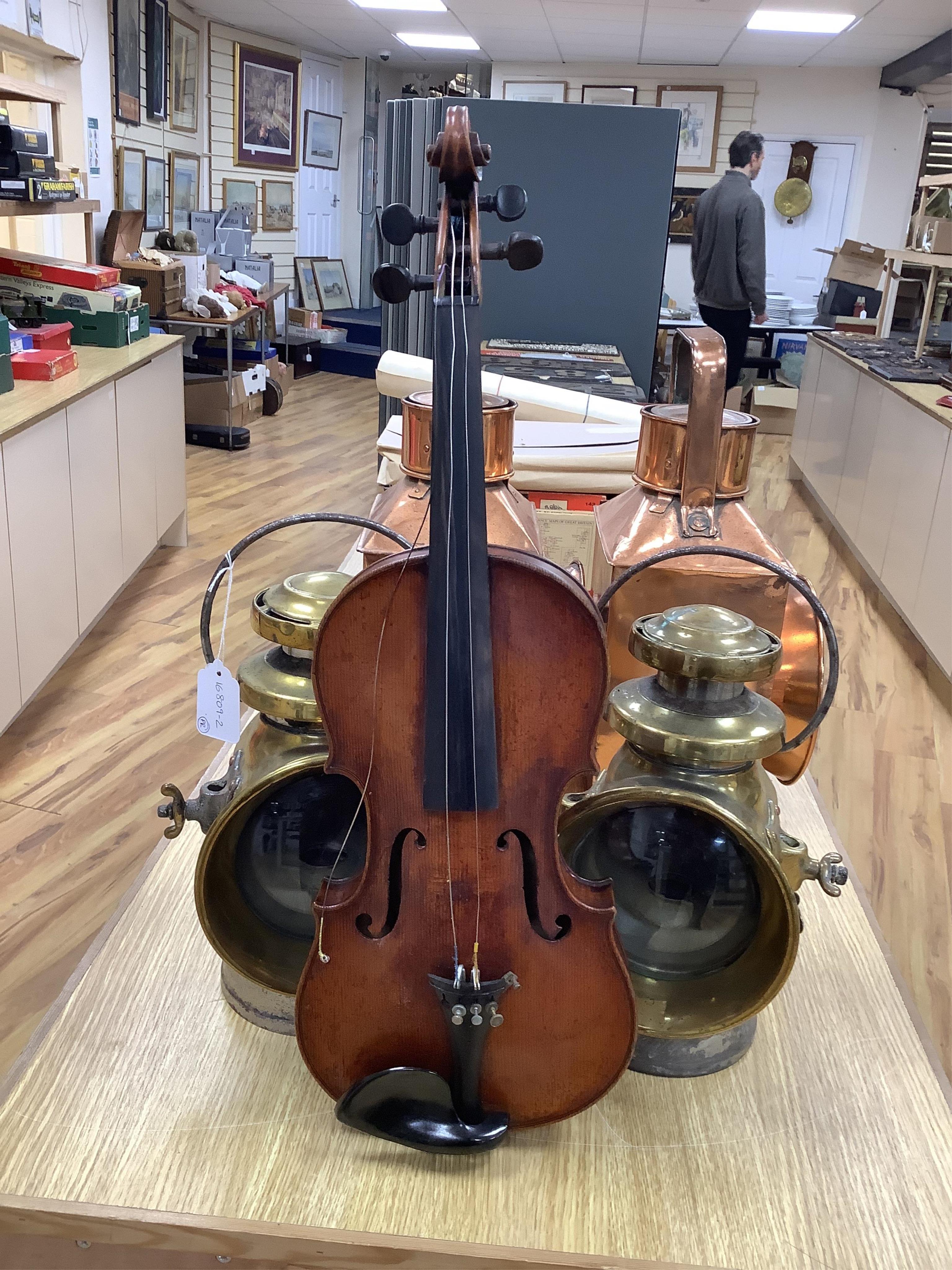 A late 19th cased century French unmarked violin and bow, body 35cm high.